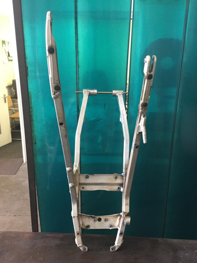 Rear frame welded and checked straight.