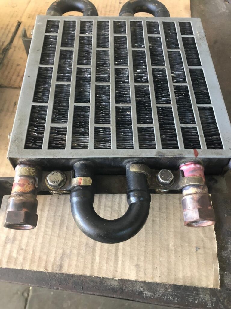 Finned radiator core repaired and pressure-ready.