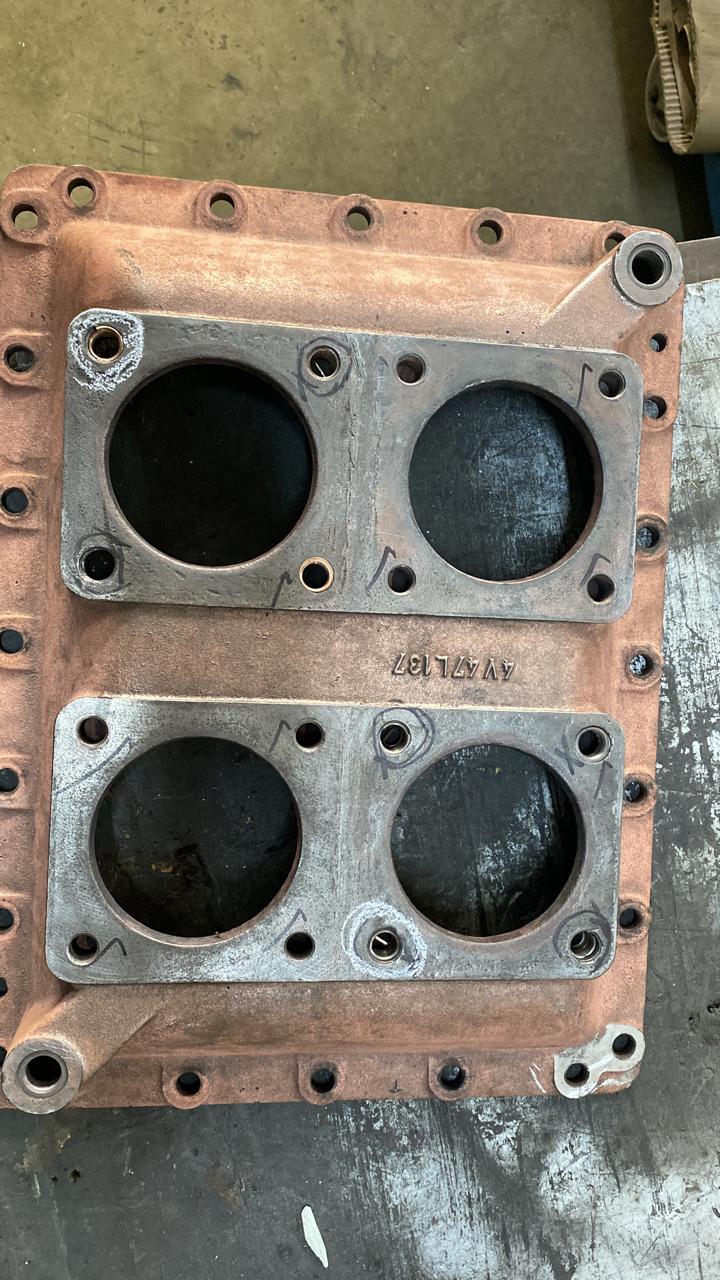 Copper alloy plate with machined bores.