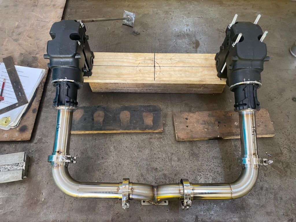 Stainless pipework assembly fitted with pumps on a test rig.