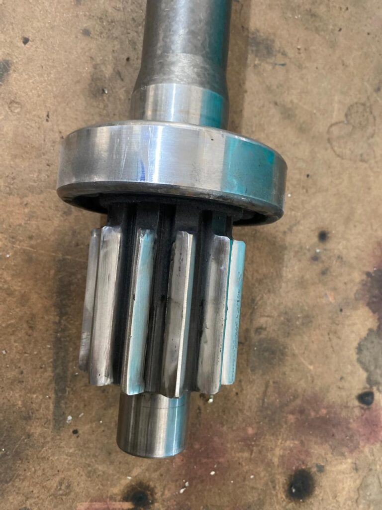 Precision machined replacement shaft with splines.